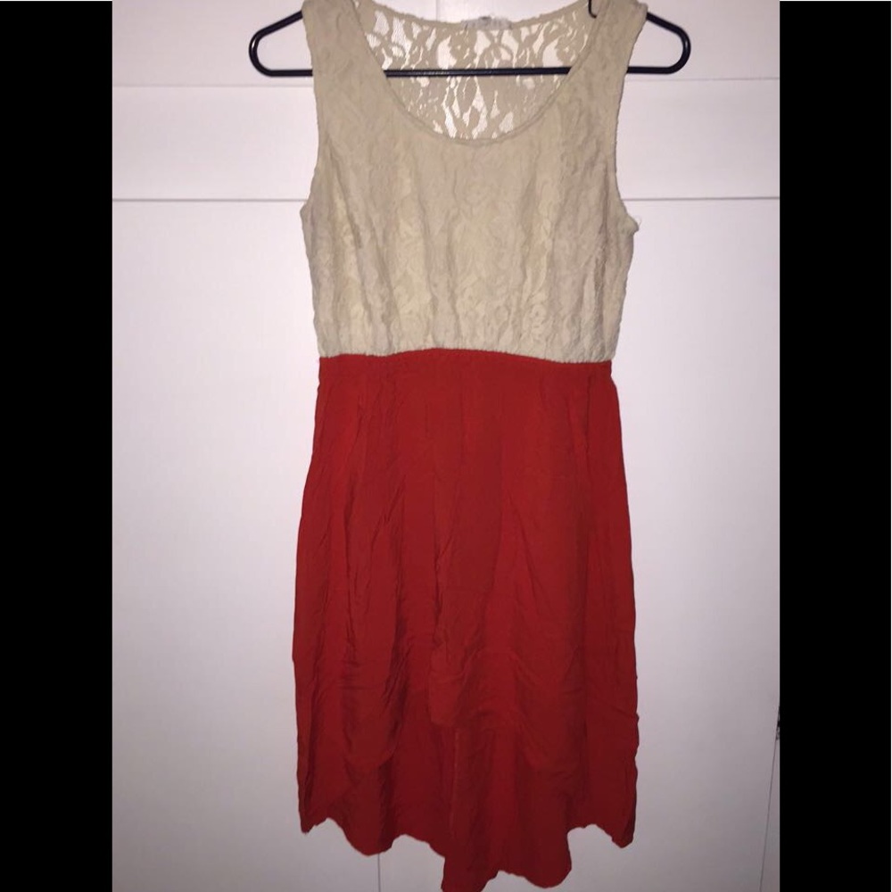 A cream and red high low dress